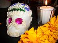 English: "Altar de muertos" detail. Sugar skull "Calavera" and cempasúchil flower (Tagetes erecta).