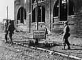 Soldiers of the 504th Parachute Infantry Regiment move through Aachen, Germany. Aachen was the first large German city to be taken by the Allies.