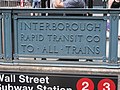 An old sign for the IRT at the Wall Street 2/3 stop.