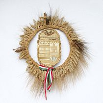Hungarian traditional folk art: harvest wreath, spun fresh wheat, with the Hungarian coat-arms