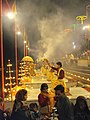 Ganga Aarti with incense at Varanasi ghats.