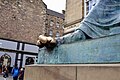 Blank rubbed toe of the statue due to the respectless believe of bringing luck