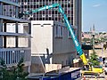 Long reach excavator demolishing a building in Arlington, Virginia