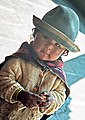 Yolanda, in traditional dress, working as a photo model for tourists in Cusco, Peru