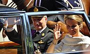 Belgian King Philippe and Queen Mathilde wave to the crowds in Brussels after Philippe's swearing in as new Belgian king (21 July 2013)