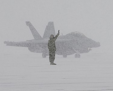 Sailor directs an EA-18G during snow storm in Japan (8367035559)
