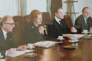 English: at the Cabinet table in the White House