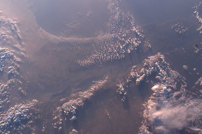 a remote view of Gaza Strip coast with clouds, Negev Desert, Israel and the Dead Sea