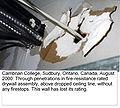 Improper breach of fire-resistance rated drywall assembly, August 2000, Cambrian College, Greater Sudbury, Ontario, Canada.