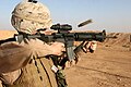 A U.S. Marine with an M16A4 equipped with an ACOG in Iraq