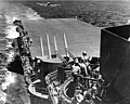 An F6F-3 "Hellcat" fighter lands aboard USS Lexington (CV-16) during the "Marianas Turkey Shoot" phase of the battle, 19 June 1944.