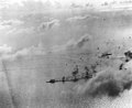 Japanese Carrier Division Three under attack by Task Force 38 planes, 20 June 1944. The battleship in the lower center is either Haruna or Kongo. The carrier Chiyoda is at right.