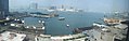 View of Star Ferry and Queen's Pier being engulfed by reclamation projects in Victoria Harbour.