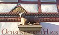 Deutsch: Die Darstellung eines ruhenden Ochsen über dem Eingang des Ochsenbäckerhauses in Tann (Rhön) English: A figurine of an resting ox, above the entrance of "Ochsenbäckerhaus" (ox baker house)