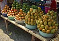 Mangga golek (yellowish one, front), mangga gedong (reddish, far left), and mangga arumanis (back, dark green). Sold at roadside of Tomo, Sumedang, West Java.