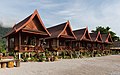 96 Row of five red wooden bungalows on stilts with terraces and steep roofs Otherside guesthouse Vang Vieng Laos uploaded by Basile Morin, nominated by Basile Morin,  11,  0,  0