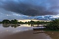 21 Blue stormy clouds at sunset with water reflection and a pirogue moored to the bank, in Don Det, Laos uploaded by Basile Morin, nominated by Tomer T,  15,  0,  0