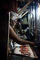 A weaver at silk handloom, in Varanasi, making a Banarasi sari, which usually takes two months.