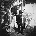 Oswald with rifle, supposedly taken in Oswald's back yard, Neely Street, Dallas Texas, March 1963