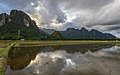 27 Water reflection of the mountains of Vang Vieng with crepuscular rays uploaded by Basile Morin, nominated by Basile Morin,  14,  1,  0