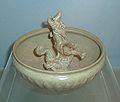 Celadon bo (bowl) with modeled dragon design. Longquan ware, Yuan Dynasty, reign of Daoguang (1271-1368). On display at the Shanghai Museum in Shanghai, PRC.