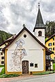 Front of the Kapelle St. Johannes Baptista (Vulpera) Special mural with biblical motif. → Places/Buildings/Religious buildings and shrines