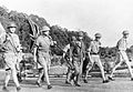 Lieutenant-General Percival and his party carry the Union Jack on their way to surrender Singapore to the Japanese - 15 February 1942