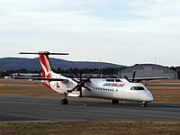 A Qantas Bombardier DHC-8-402Q taxiing to take off from Canberra Airport