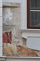 Historical residential building with wall painting: Wo die Kuh am Brett spielt