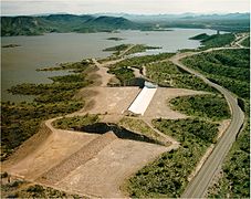 An emergency spillway with fuse plug (bottom) and an auxiliary ogee spillway (top).