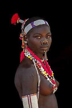 Portrait of young woman from the Laarim Tribe, Kimotong, Kapoeta State, South Sudan.