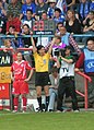 Fourth official signaling a substitution.