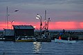 incoming small fisher boat early the day in the harbour of snogebaek, island Bornholm, Denmark