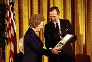 English: awarded the Presidential Medal of Freedom by Bush , 1991