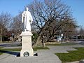 A statue of Charles Kingsley, beside the "wonky conker"