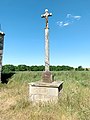 Cette croix située à Corseul dans les Côtes d’Armor, datant de 1895, est l’œuvre de l’atelier Yves Hernot à Lannion. Déplacée au Template:20e siècle, elle se trouve près de la chapelle Sainte-Eugénie.
