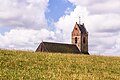 Zicht op de Mariakerk van Wierum vanaf de zeedijk.