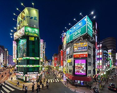 "Buildings_with_colorful_neon_street_signs_at_blue_hour,_Shinjuku,_Tokyo.jpg" by User:Basile Morin