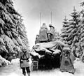 Tanks and Infantrymen of the 82nd Airborne Division, Company G, 740th Tank Battalion, 504th Regiment, push through the snow towards their objective in Belgium. U.S. First Army near Herresbach.