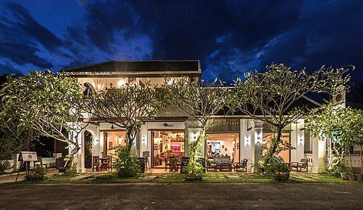 "Exterior_facade_of_Residence_Bassac_at_blue_hour,_town_of_Champasak,_Laos.jpg" by User:Basile Morin