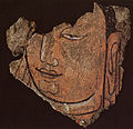 Detail of a Buddha's head 21B. High register of the sanctuary B wooden and painted plaster, Keriya Valley. Early 3 th. Provincial Museum, Ürümqi.