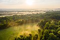 "Crepuscular_rays_over_parc_de_Noisiel_at_sunrise,_26_May_2019.jpg" by User:B2Belgium