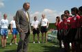 Donald Rumsfeld with members of Washington Freedom soccer team speaking to Afghan girls visiting Washington, D.C.