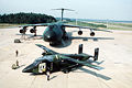 A C-23 Sherpa and a C-5A Galaxy are parked on the "hot cargo pad."