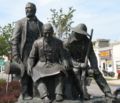 Statue of 3 pioneers at Pioneer Square, Westport Road and Broadway.