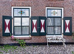 residential building Tsjerkeplein 2, Wierum. 2 windows in the facade